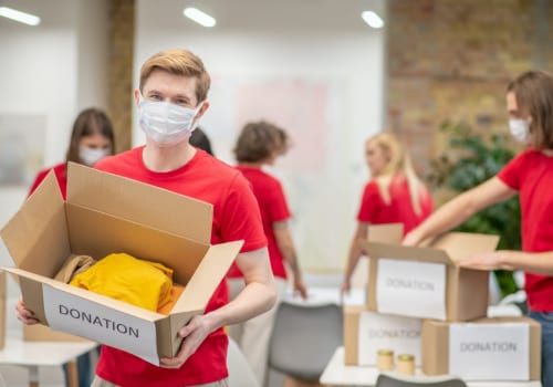 volunteers-in-facial-masks-working-with-donations-sorting.jpg
